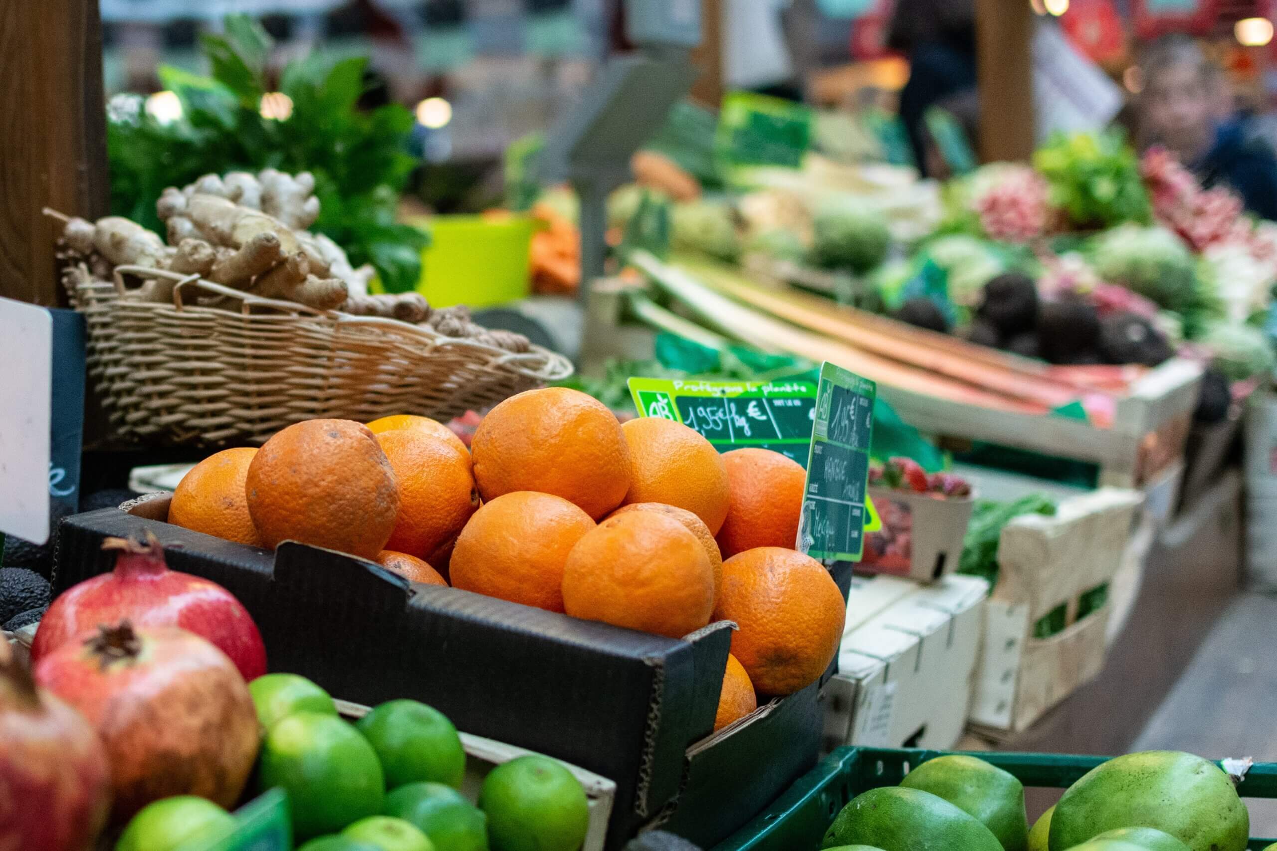 a group of oranges in a France market