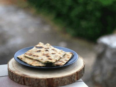 Soparnik - This is made of two sheets of thin dough filled with swiss cheese, onions, parsley, salt, olive oil, and garlic. 