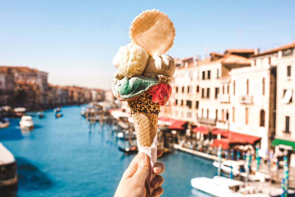 eating gelato overlooking canal in italy while traveling gluten free italy.