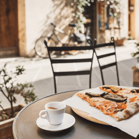 Eating with egg allergy in italy, enjoying an egg free pizza at cafe.