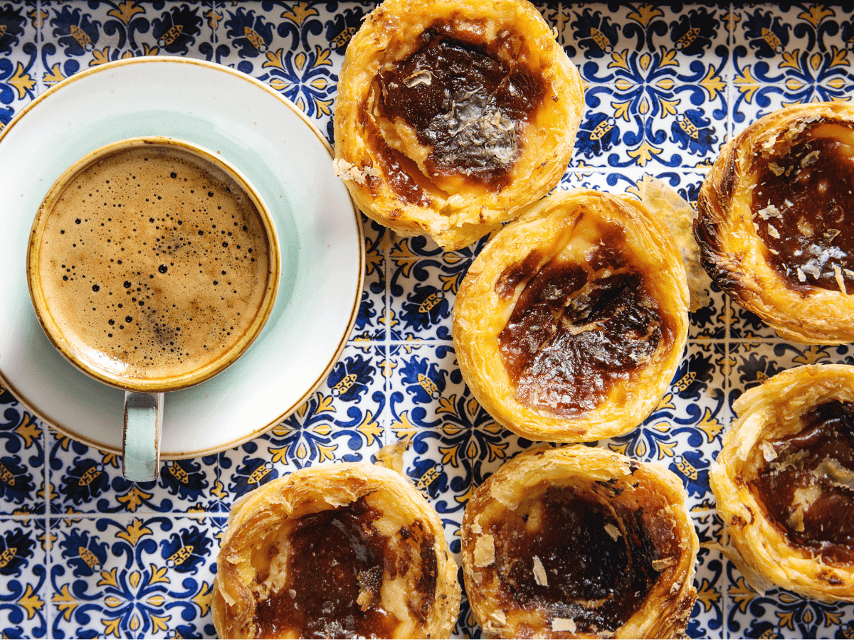 Image of pastel de nata custards, an iconic Portuguese pastry that is delicious with a morning cup of coffee.