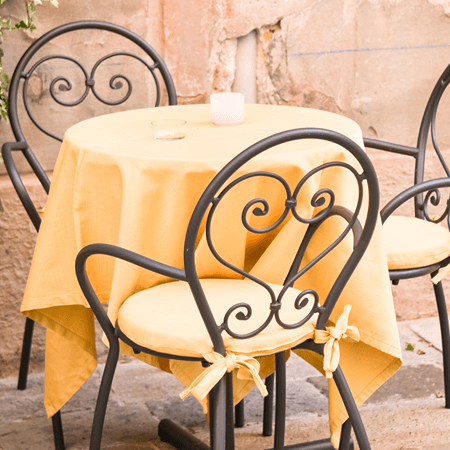 a image of a table at restaurant in italy with a yellow table cloths eating shellfish free in italy