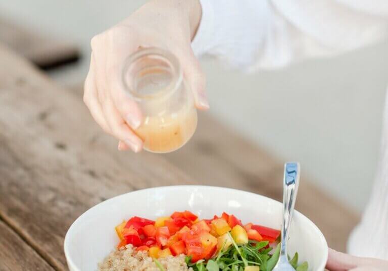 Food allergy travel agent eating a allergy friendly meal of fresh vegetables and rice.